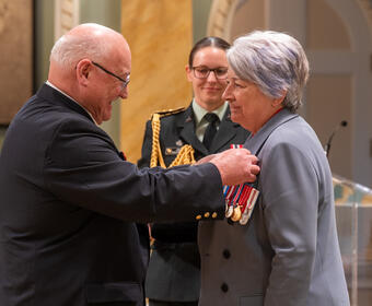 Governor General Mary Simon receiving the first poppy of 2025