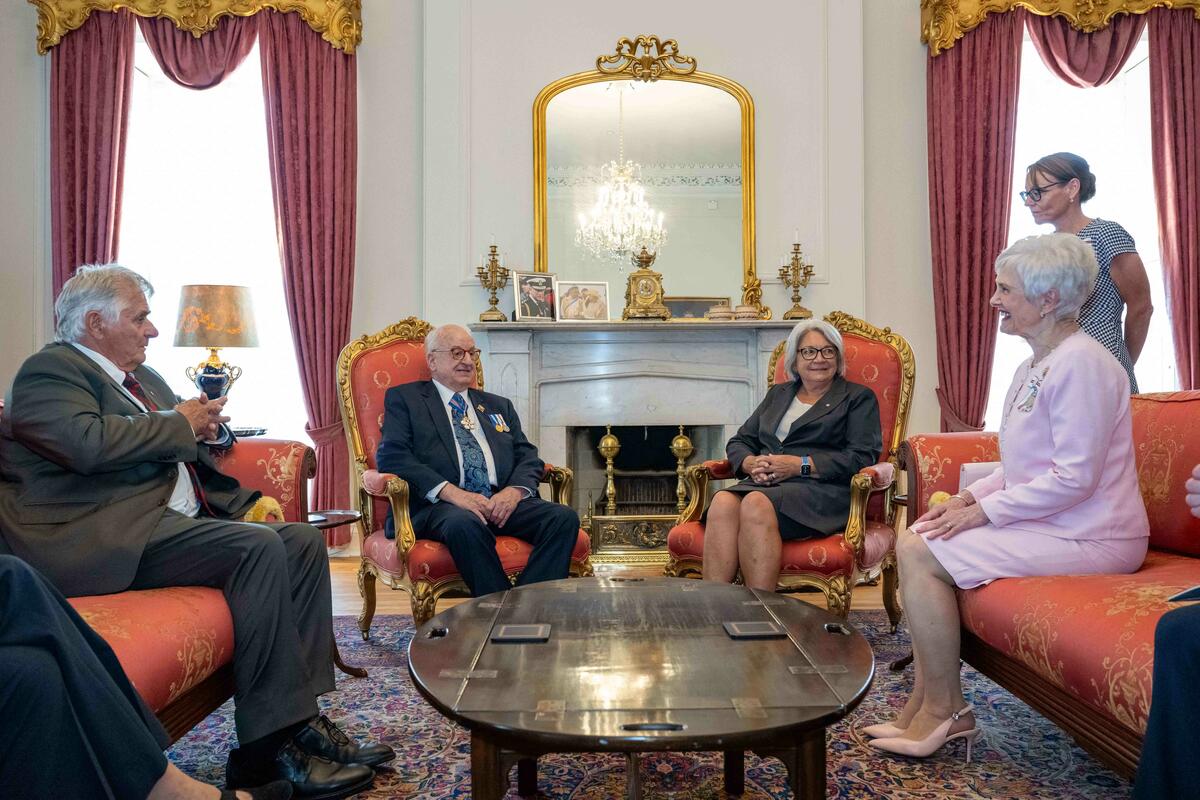 The Governor General sits in a chair with His Honour the Honourable Arthur J. LeBlanc, Lieutenant Governor of Nova Scotia