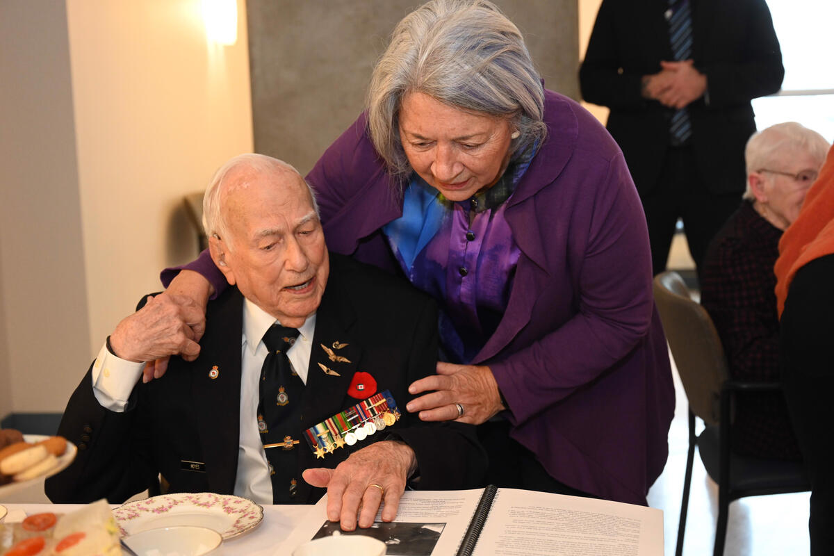 Governor General Mary Simon speaks with a veteran